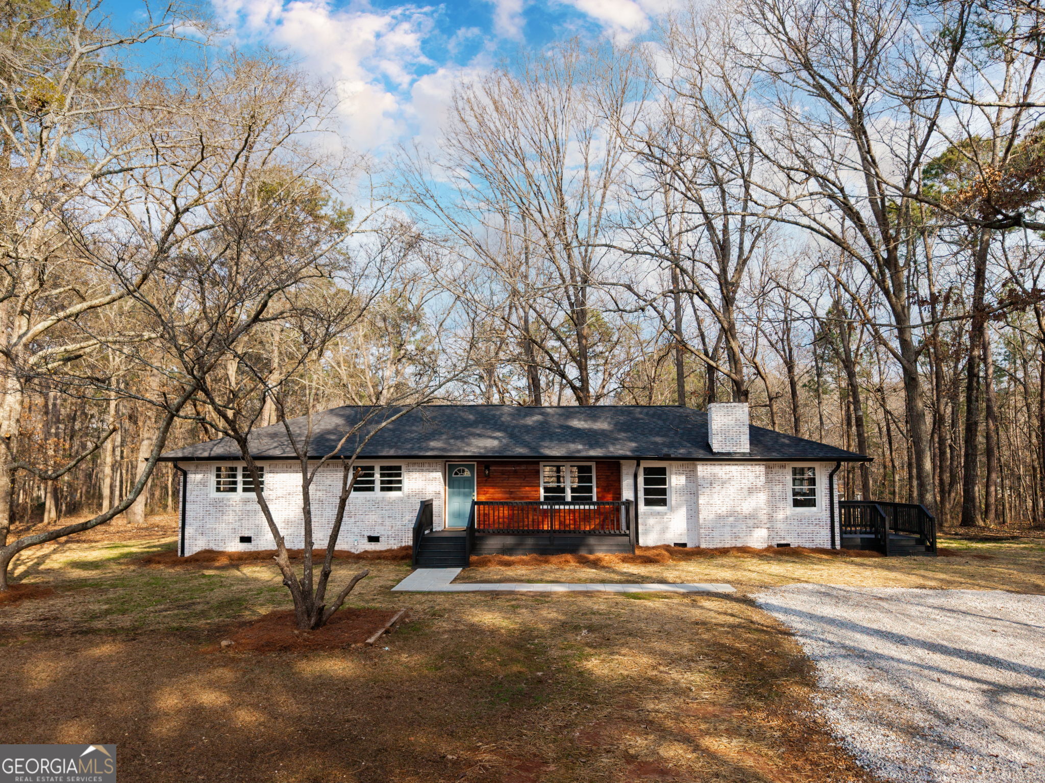 a front view of a building with parking space and parking space