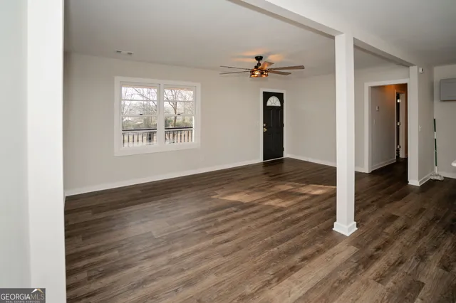 a kitchen with a sink stove top oven and cabinets