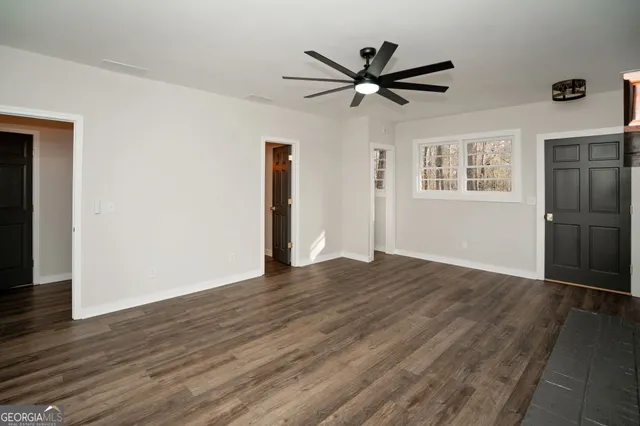 a view of an entryway with wooden floor