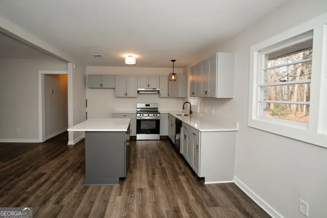 a bathroom with a sink and mirror