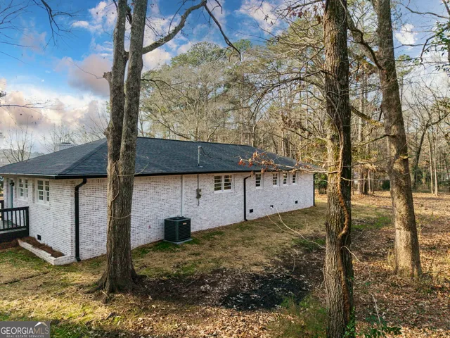 a backyard of a house with lots of green space