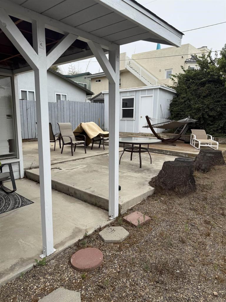 157 Maple Avenue Carlsbad, CA 92008 - Photo 8 of 16 a view of a patio with table and chairs potted plants