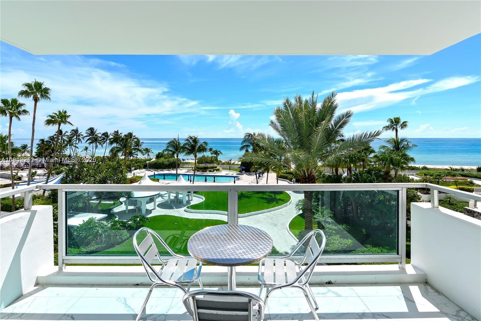 5151 Collins Avenue, Unit 619 Miami Beach, FL 33140 - Photo 2 of 16 a view of a chairs and table in patio