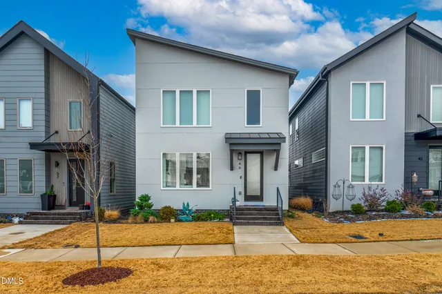 a front view of a house with garage