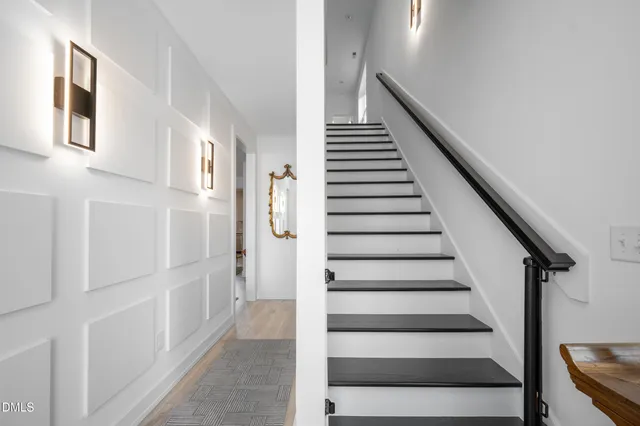 a view of a dining room with a table and chairs