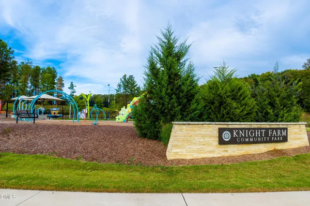 an aerial view of a house with swimming pool garden and outdoor seating