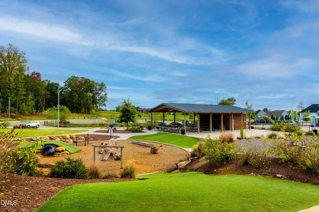 a view of a park with iron fence