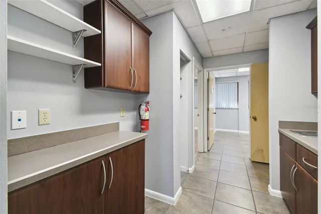 a room with a sink and cabinets