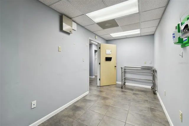 a view of a hallway with wooden shelves