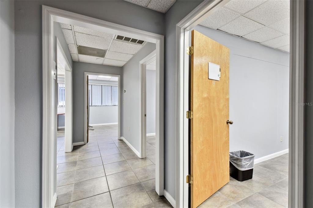 701 Enterprise Road East, Unit 100 Safety Harbor, FL 34695 - Photo 27 of 96 a view of a hallway with front door