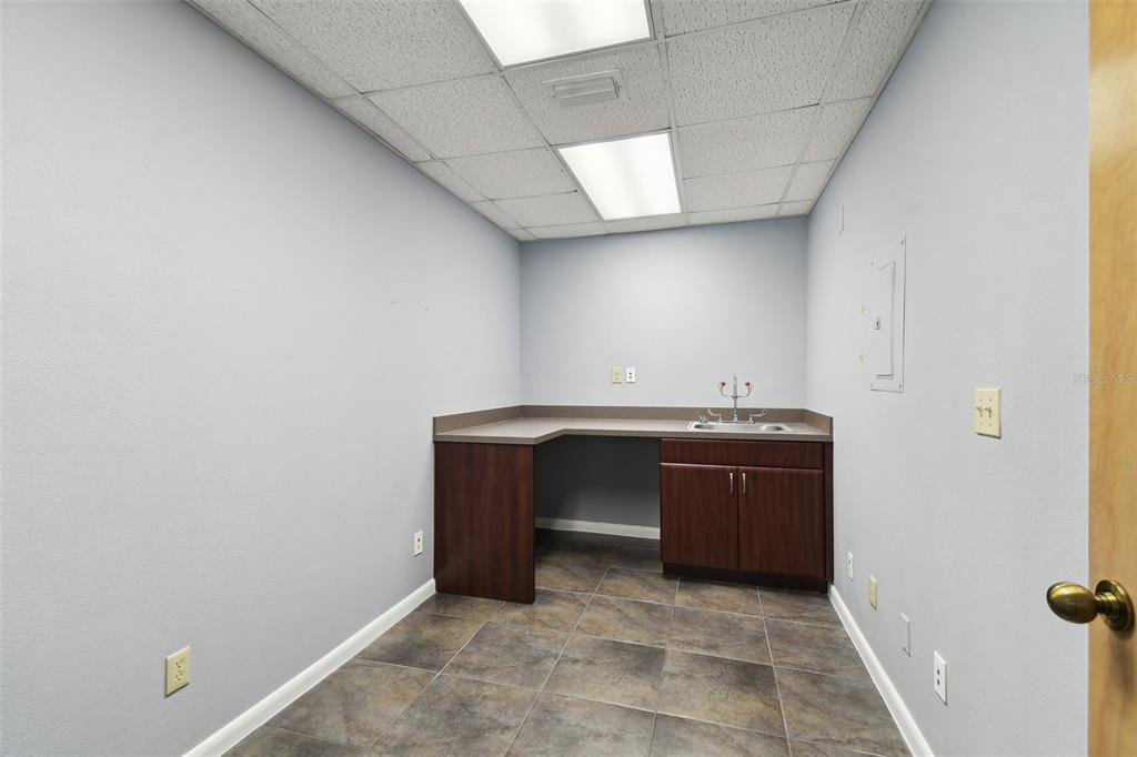 701 Enterprise Road East, Unit 100 Safety Harbor, FL 34695 - Photo 30 of 96 a room with a sink and cabinets