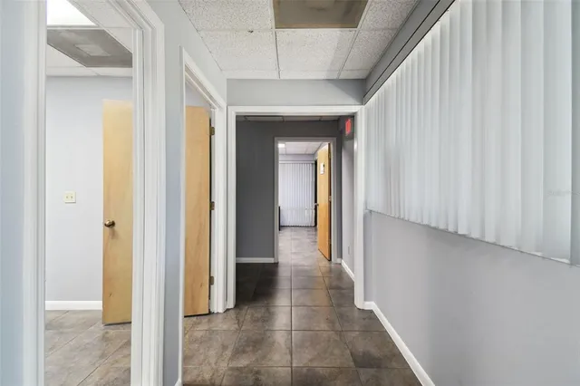 a room with wooden floor and a window