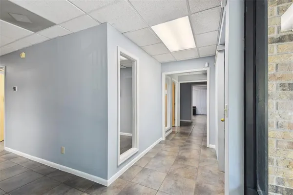 a room with pool table and furniture