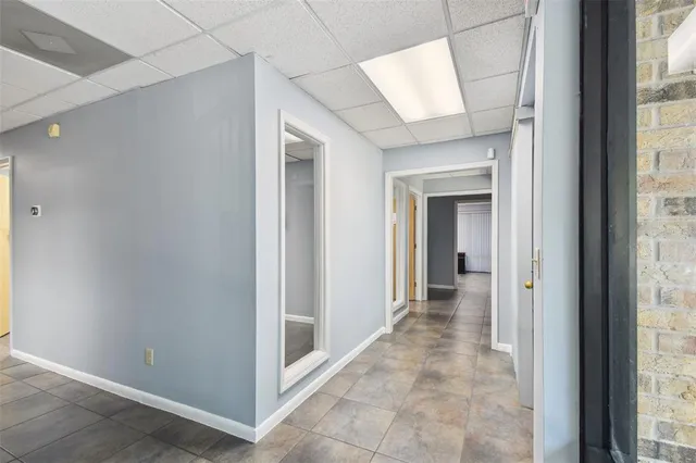 a room with pool table and furniture