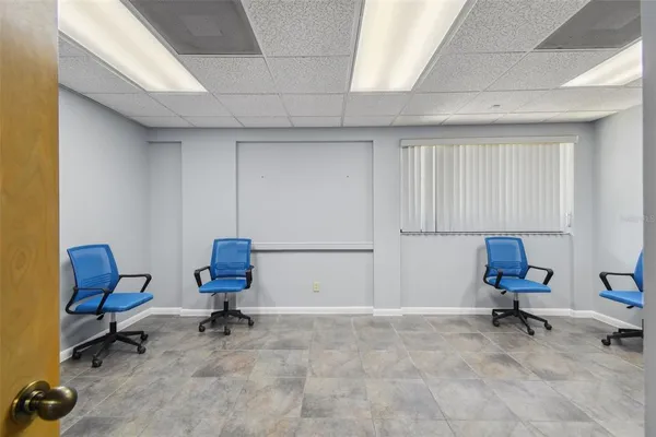 a bathroom with a granite countertop sink a mirror and shower