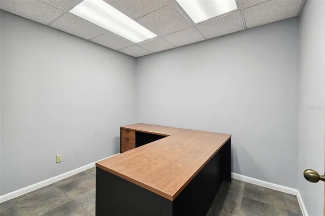 a bathroom with a granite countertop sink a toilet and a mirror