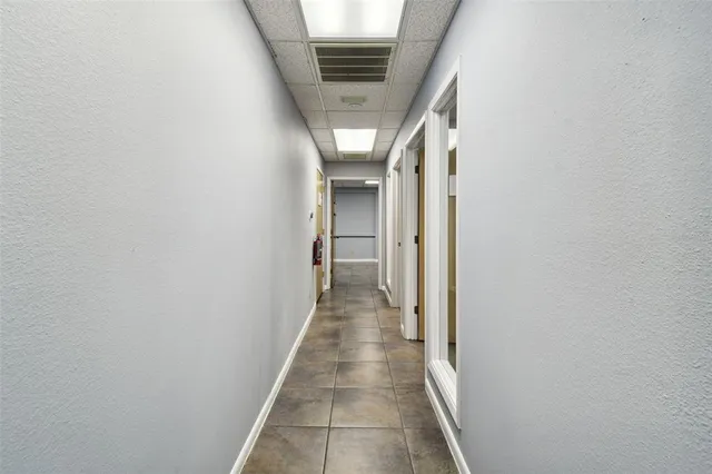 a view of a dining room with furniture and a window