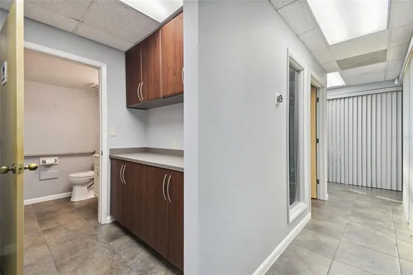 a bathroom with a sink toilet and a mirror