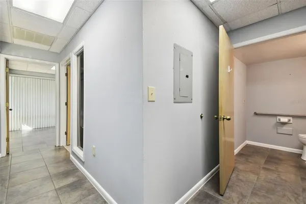 a bathroom with a glass door shower a mirror and a sink