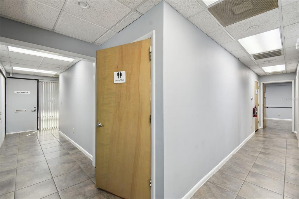 701 Enterprise Road East, Unit 100 Safety Harbor, FL 34695 - Photo 51 of 96 a view of a hallway with wooden shelves