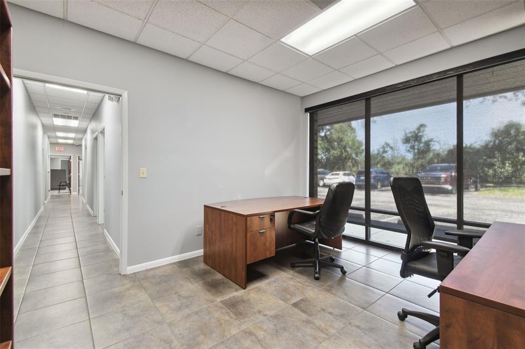 701 Enterprise Road East, Unit 100 Safety Harbor, FL 34695 - Photo 68 of 96 a view of workspace with furniture and floor to ceiling window
