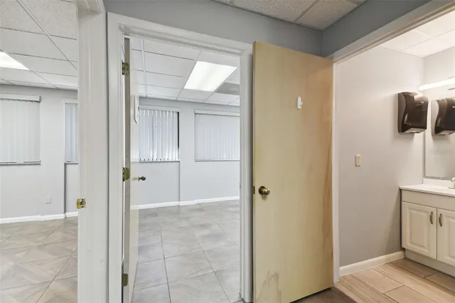 a kitchen with a sink stainless steel appliances and cabinets