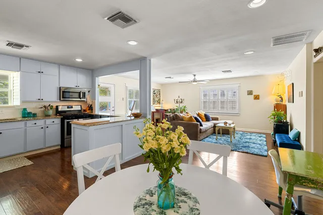 a kitchen with counter top space a sink appliances and cabinets