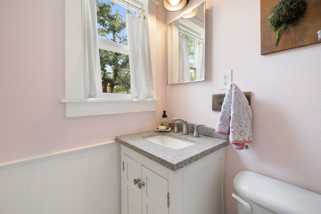 4607 Kitty Avenue Austin, TX 78721 - Photo 23 of 33 a bathroom with a sink and a toilet