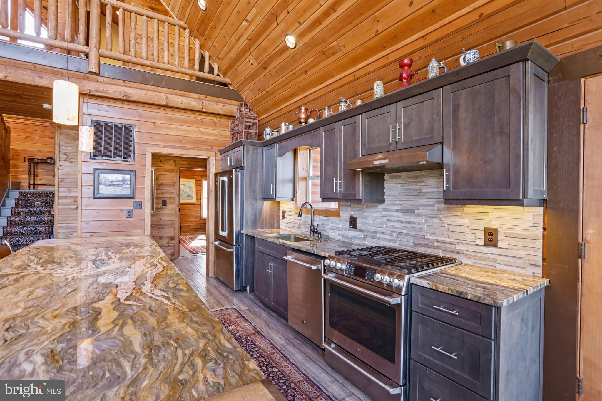3444 Calmes Neck Lane Boyce, VA 22620 - Photo 12 of 66 a kitchen with stainless steel appliances granite countertop a stove and a sink
