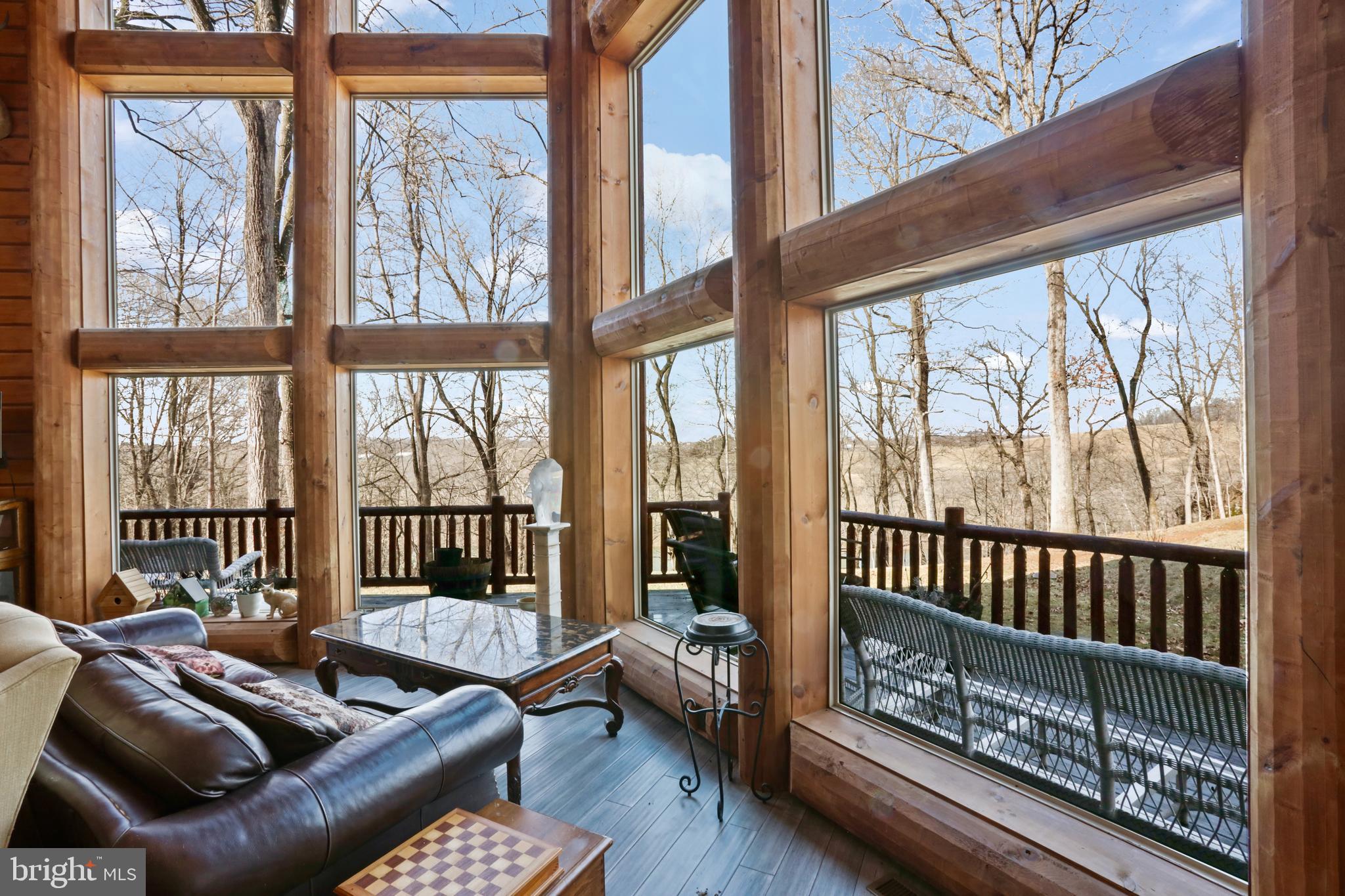 3444 Calmes Neck Lane Boyce, VA 22620 - Photo 18 of 66 a living room with furniture and a large window