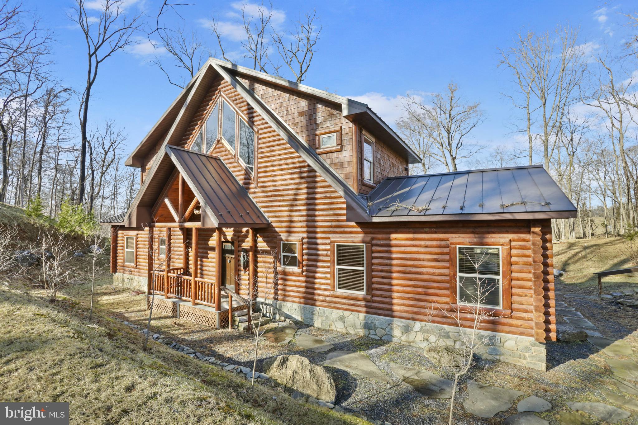 3444 Calmes Neck Lane Boyce, VA 22620 - Photo 64 of 66 a front view of a house with a garage