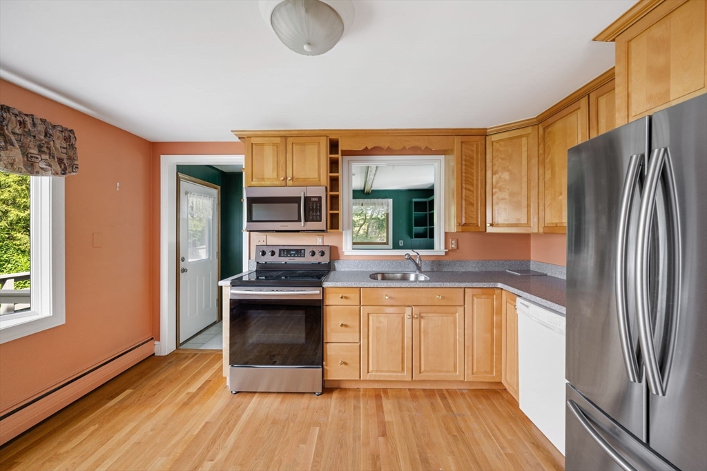 40 Bell Road Weymouth, MA 02188 - Photo 21 of 41 a kitchen with stainless steel appliances granite countertop a sink stove and refrigerator