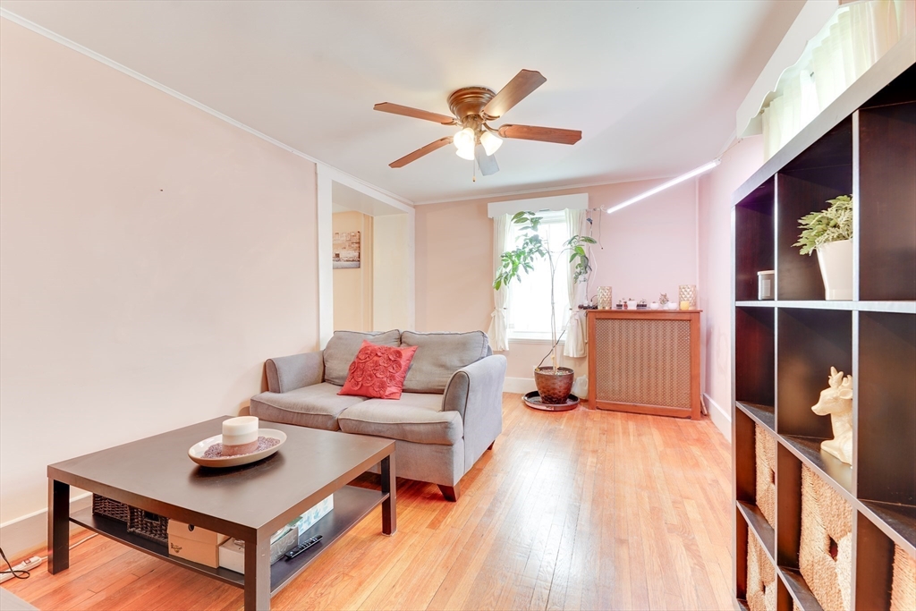 506 Washington Street Dedham, MA 02026 - Photo 12 of 28 a living room with furniture and a wooden floor