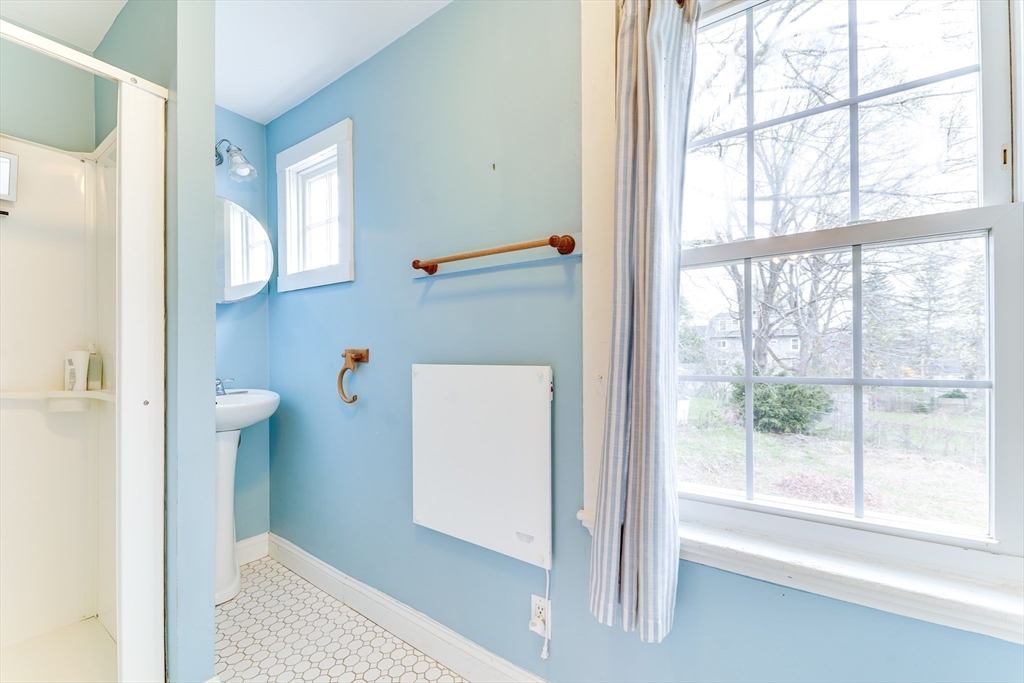 506 Washington Street Dedham, MA 02026 - Photo 14 of 28 a view of hallway with window and bathroom