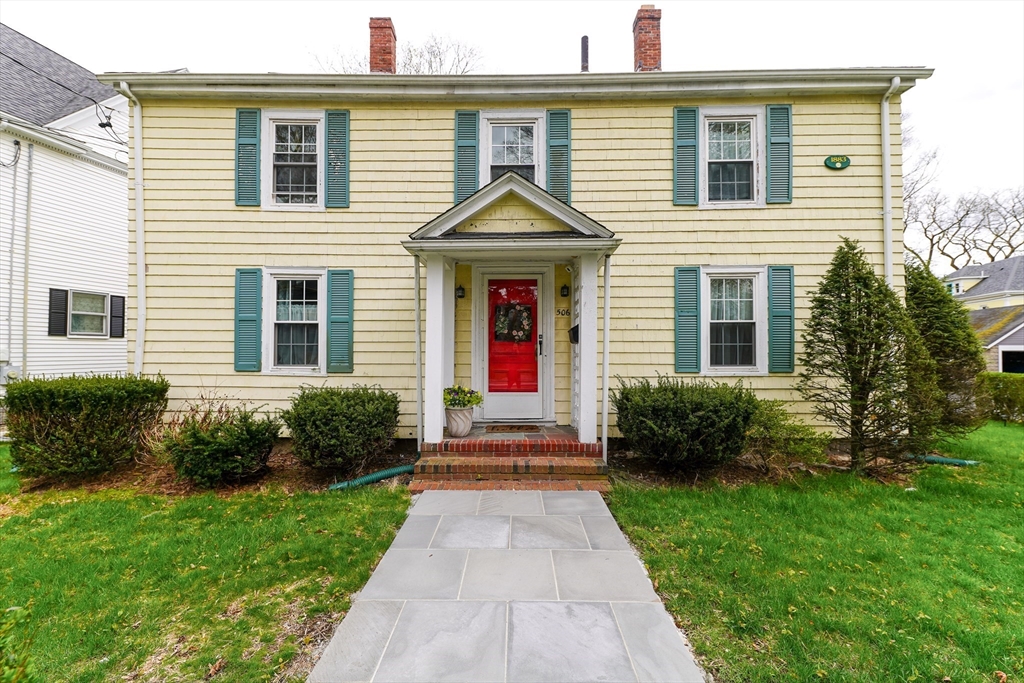 506 Washington Street Dedham, MA 02026 - Photo 2 of 28 a house view with a garden space
