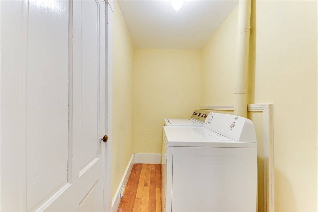 506 Washington Street Dedham, MA 02026 - Photo 23 of 28 a utility room with a sink dryer and washer