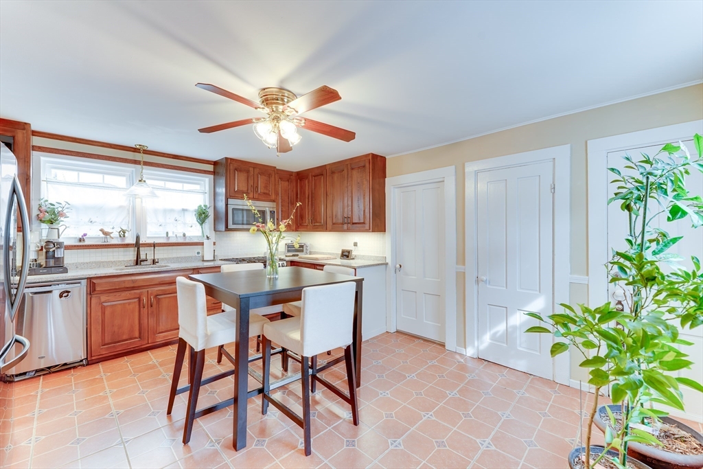506 Washington Street Dedham, MA 02026 - Photo 5 of 28 a kitchen with a table and chairs in it