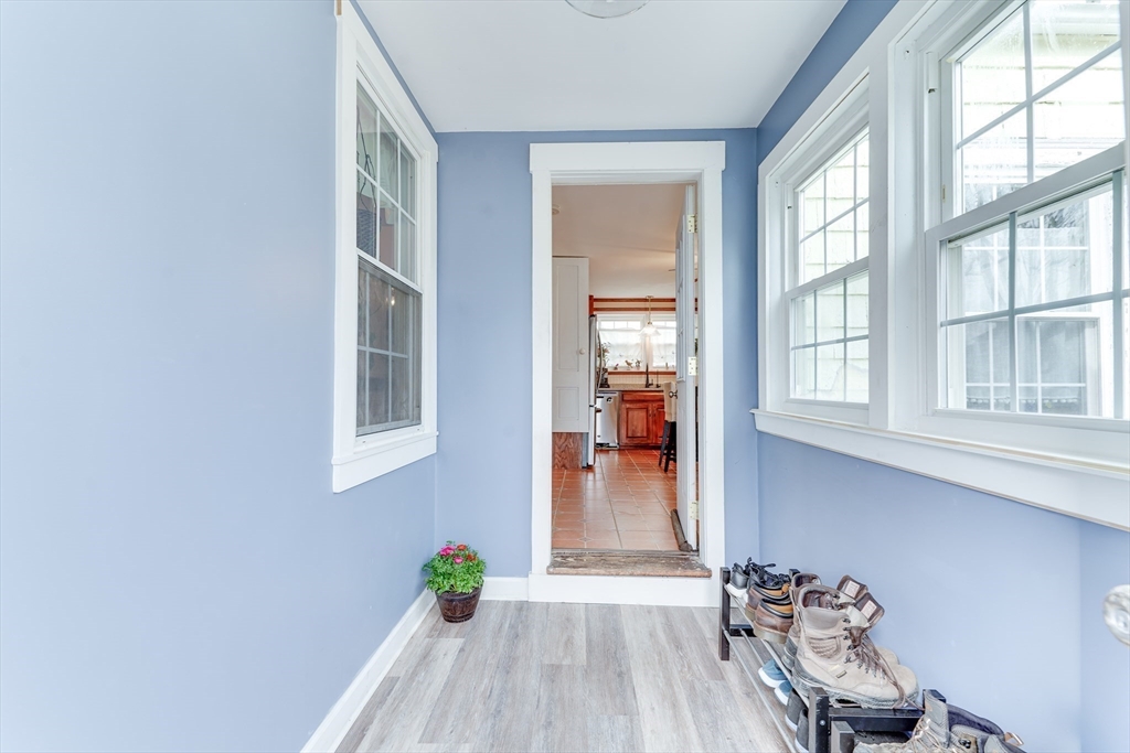 506 Washington Street Dedham, MA 02026 - Photo 8 of 28 a view of a room that has a window and wooden floor