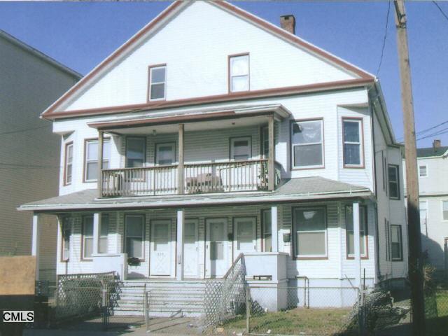 517 Brooks Street Bridgeport, CT 06608 - Photo 1 of 1 a front view of a house with a yard balcony