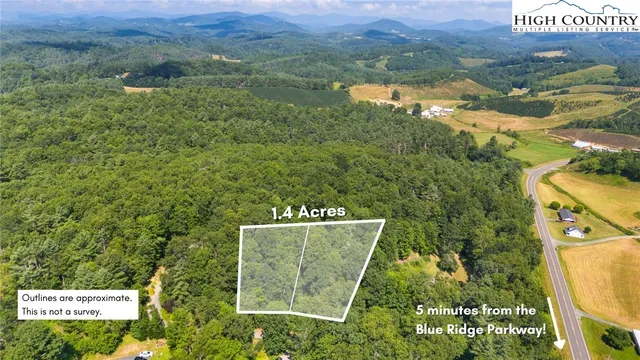 a view of a back yard from a balcony