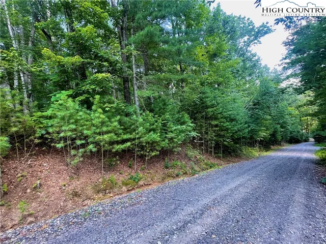 a view of a lake with a yard