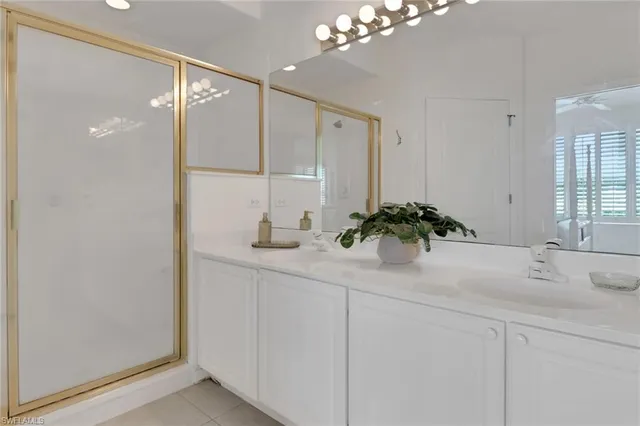 a bathroom with a sink a vanity and a mirror
