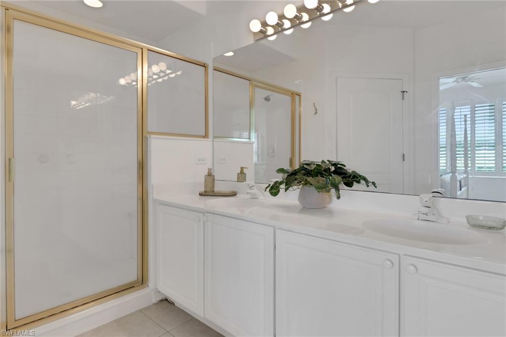 23790 Clear Spring Court, Unit 1603 Estero, FL 34135 - Photo 14 of 39 a bathroom with a sink a vanity and a mirror