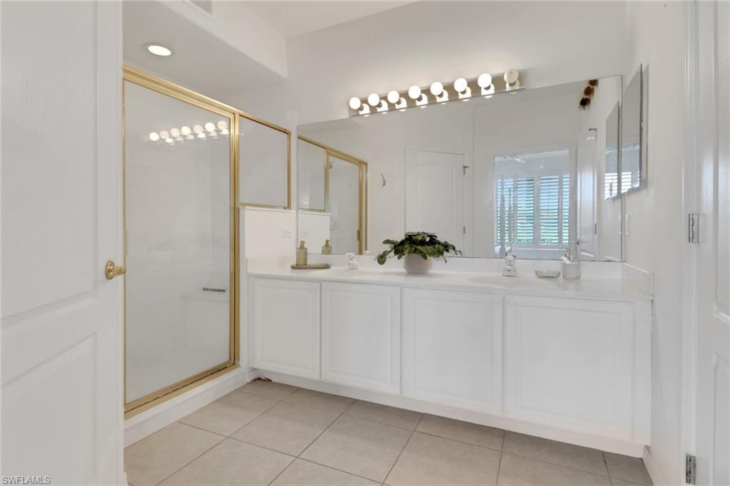 23790 Clear Spring Court, Unit 1603 Estero, FL 34135 - Photo 15 of 39 a bathroom with a sink and a mirror