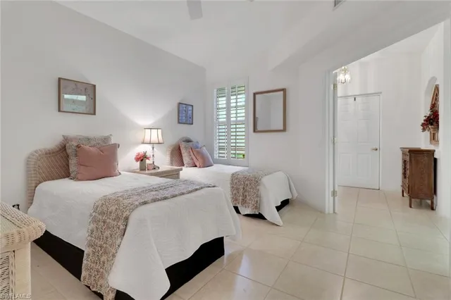 a bedroom with a bed and lamp