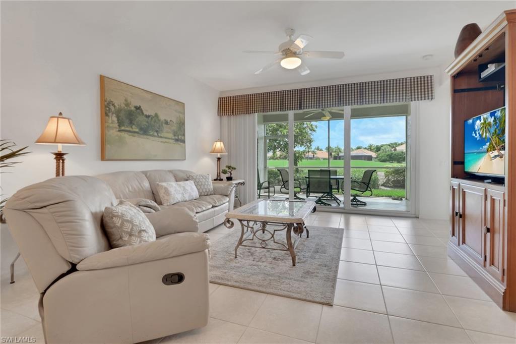 23790 Clear Spring Court, Unit 1603 Estero, FL 34135 - Photo 2 of 39 a living room with furniture and a flat screen tv