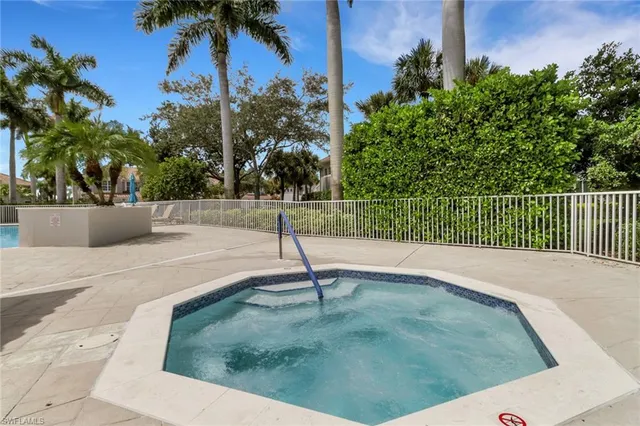 a view of a swimming pool with a sitting area