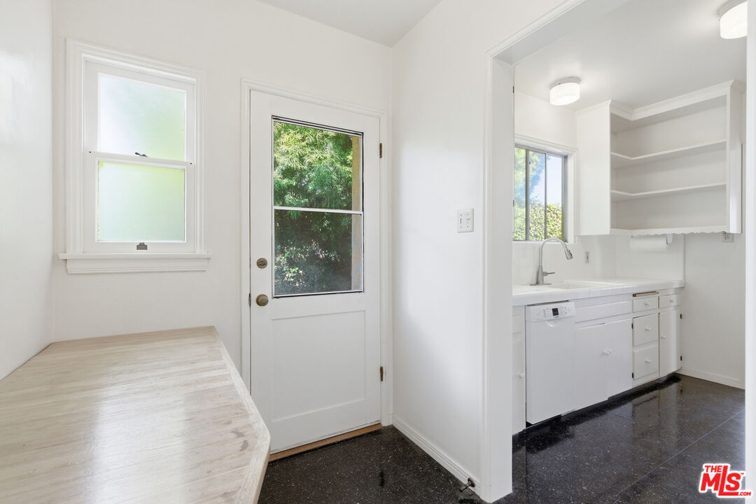 1019 Pine Street Santa Monica, CA 90405 - Photo 12 of 36 a bathroom with a sink a window and a mirror