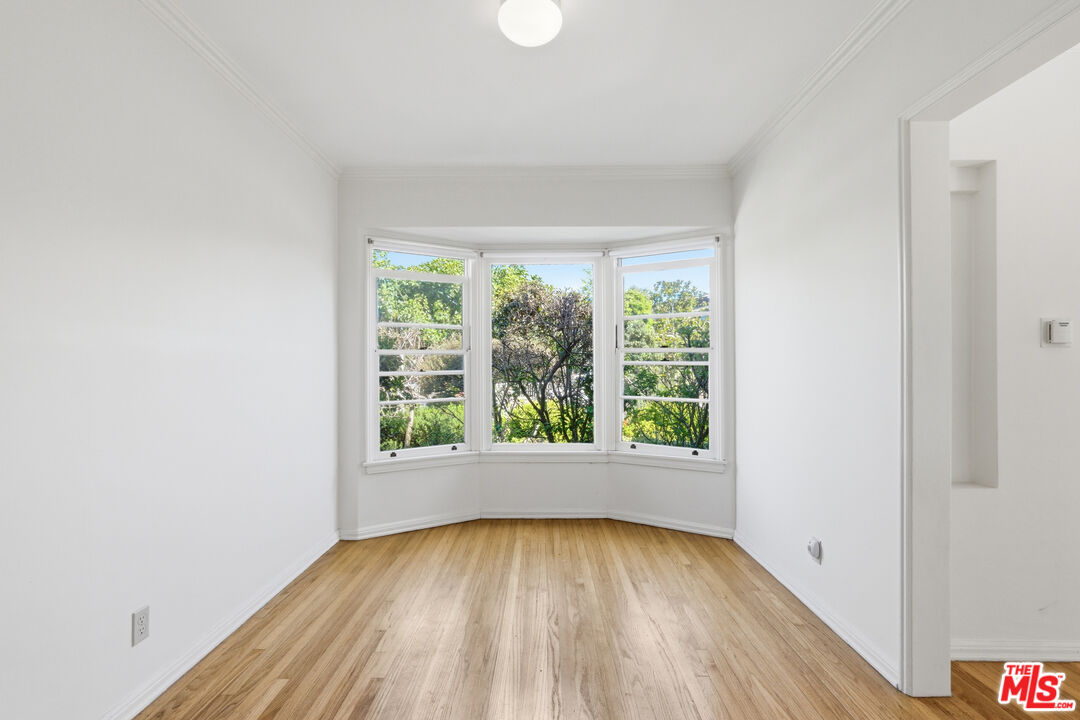 1019 Pine Street Santa Monica, CA 90405 - Photo 16 of 36 an empty room with wooden floor and windows