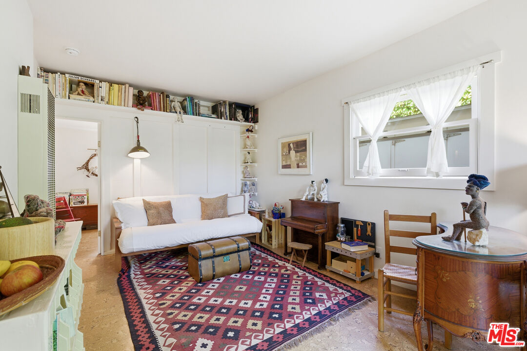 1019 Pine Street Santa Monica, CA 90405 - Photo 23 of 36 a living room with furniture and a rug